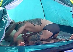 Folks pound rock-hard in front of a married duo on a public beach