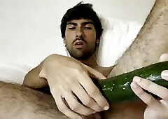 Spanish fag playing with cucumber dildo