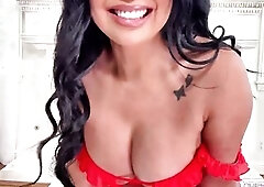 Demi is wearing a 2 piece bright orange suit as this babe struts confidently into the living room.