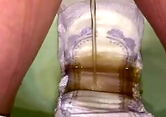 Soaking a huge pad with piss