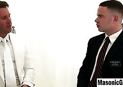 Businessman in White Suit Gives Intense Handjob to Muscular Man