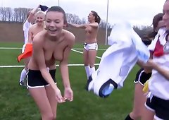 Soccer girls practicing and stripping down on the soccer field