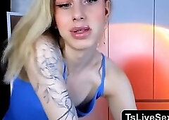 blonde femboy strokes her cock while teasing in a strip show 41