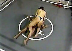 Muscle girl wrestles guy in the ring