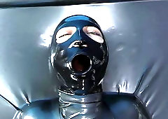 Girl in Latex Catsuit Enters Vacbed